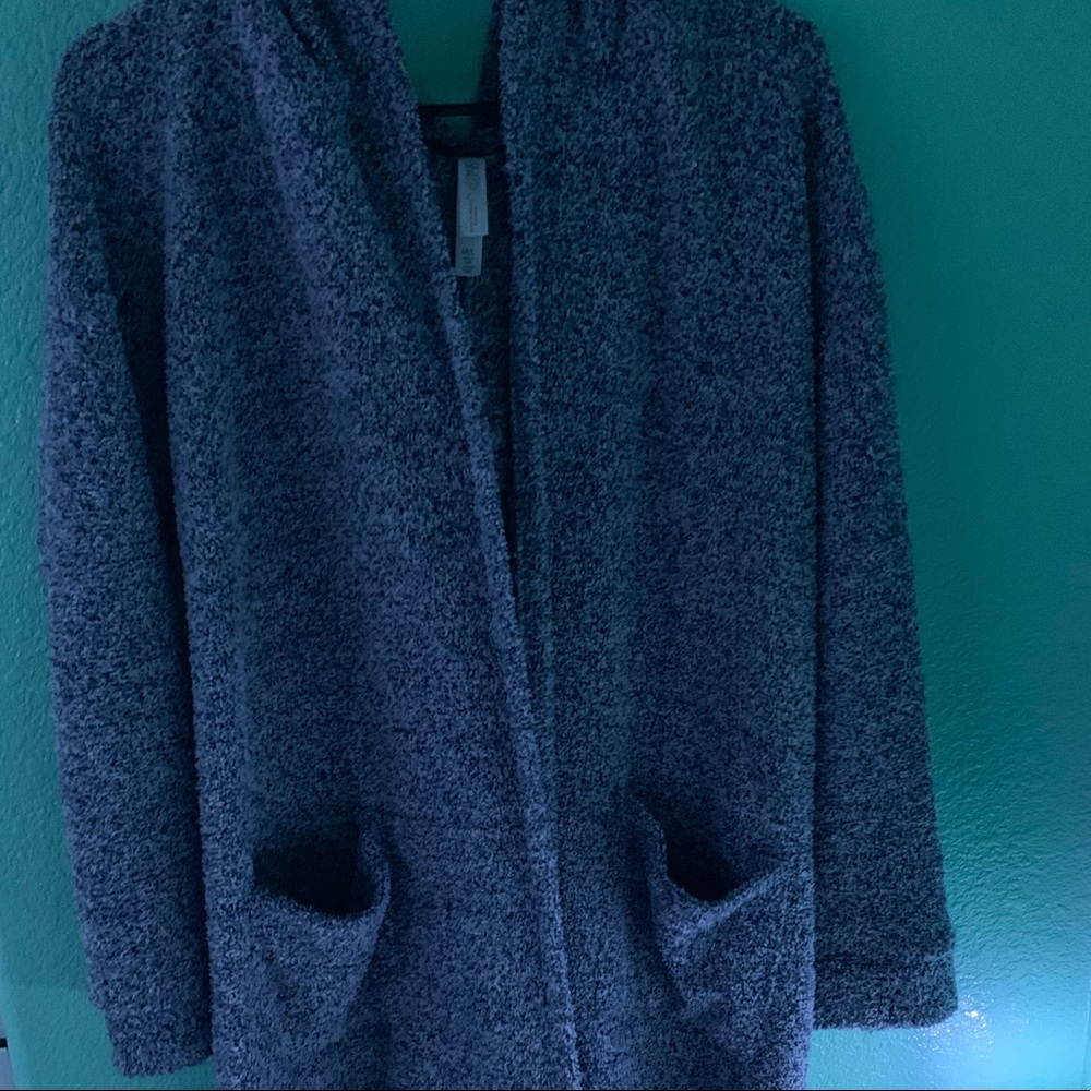 A long blue cardigan with pockets and a hood.